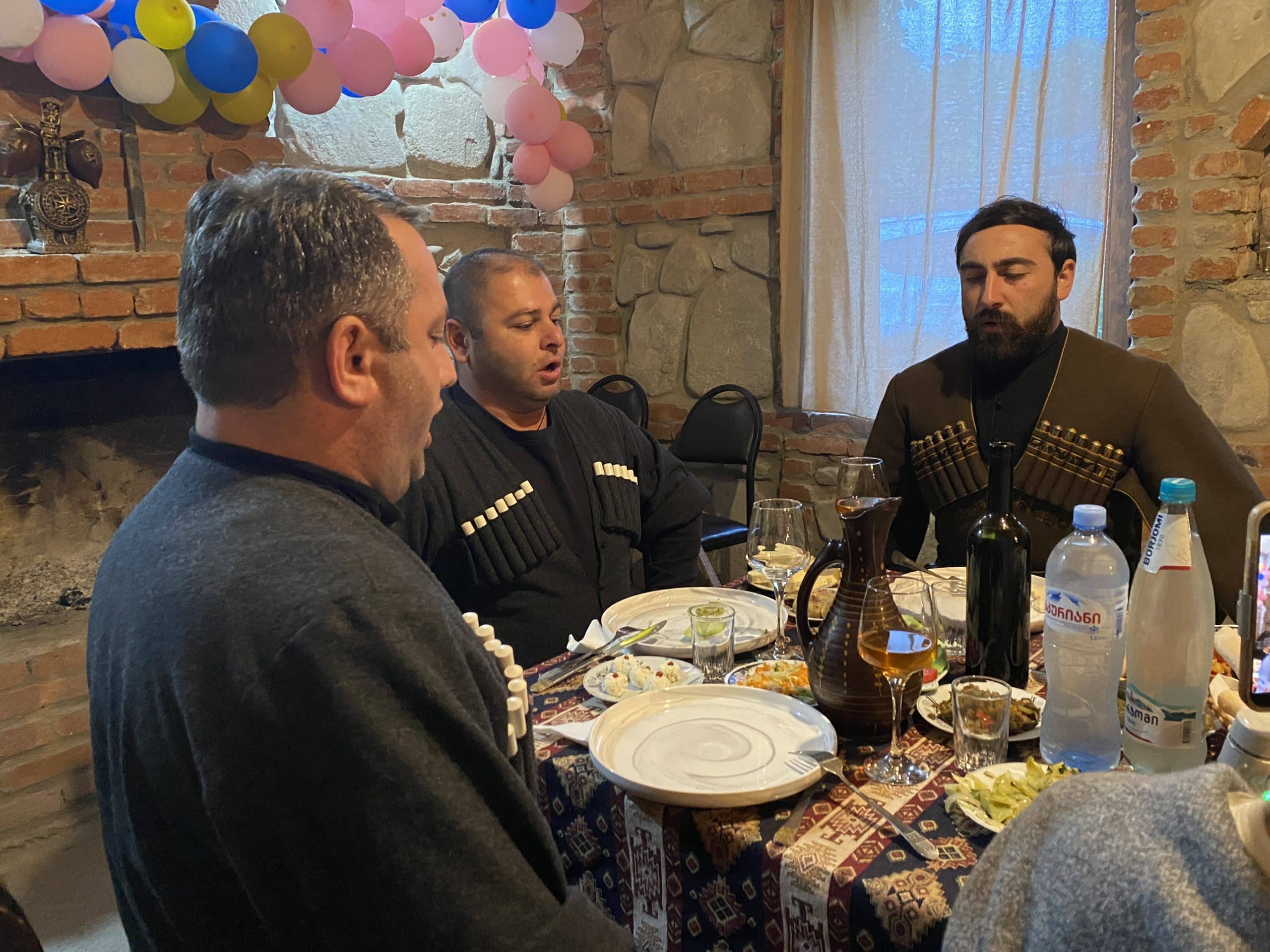 Polyphonic singers dressed in the national costume singing.