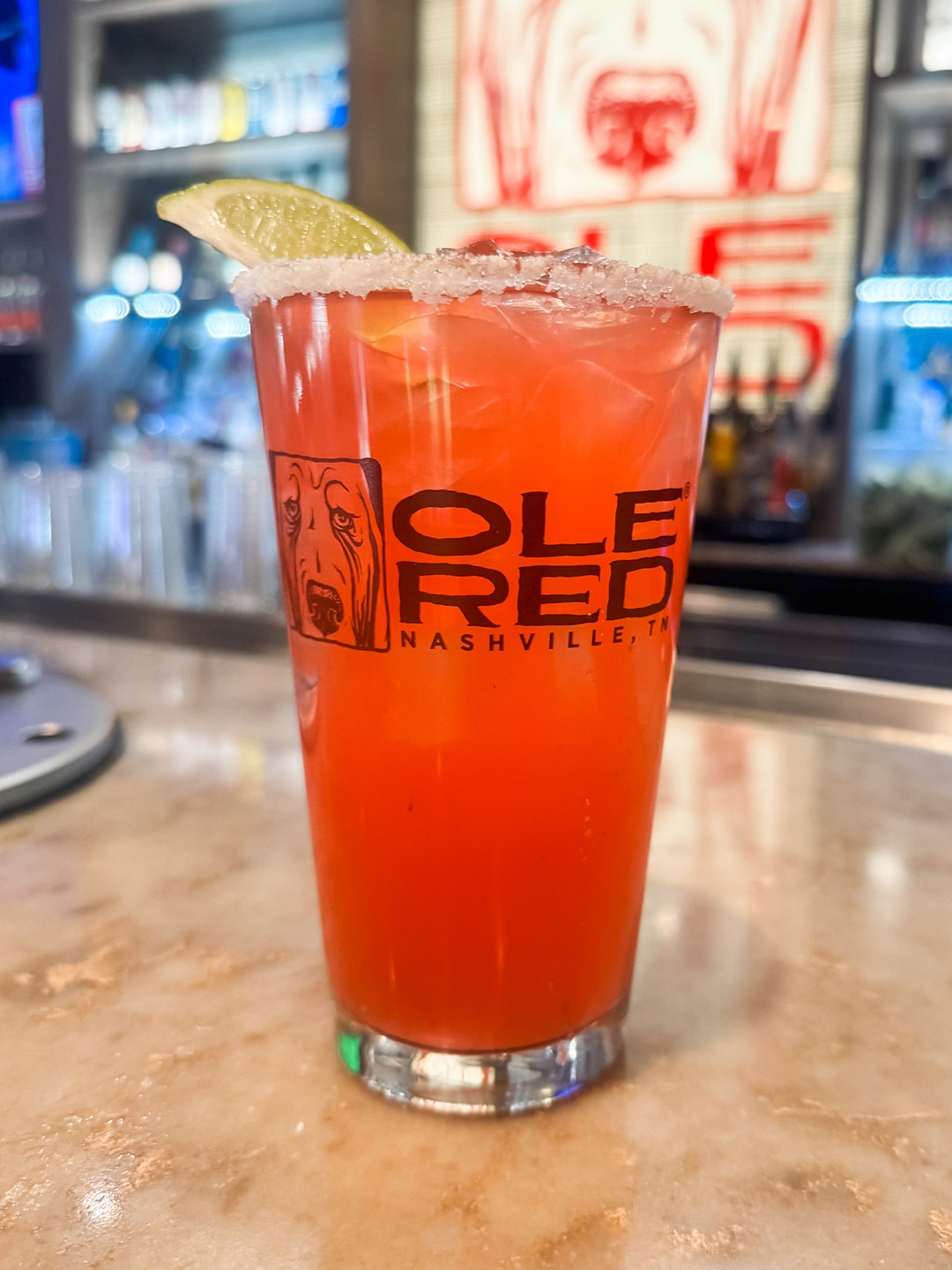 A red drink in branded Ole Red glassware