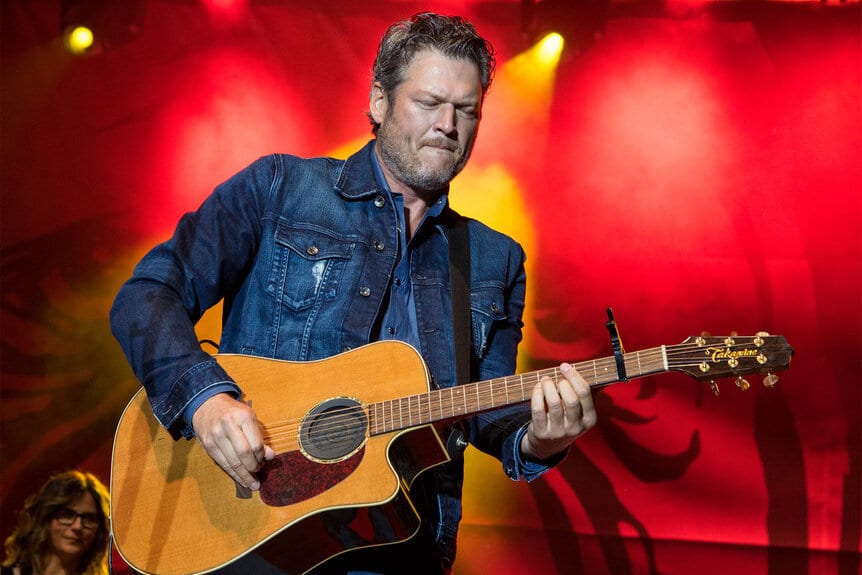 Blake Shelton playing his guitar
